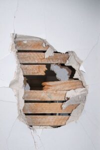plaster-repair-Columbus-Ohio-1 hole in plaster wall, with exposed lathe
